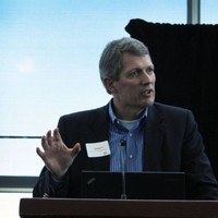 Jay Larsen speaking at an event.